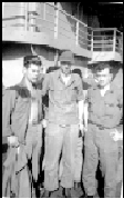 Lynn Swango on ship deck with two friends in uniform